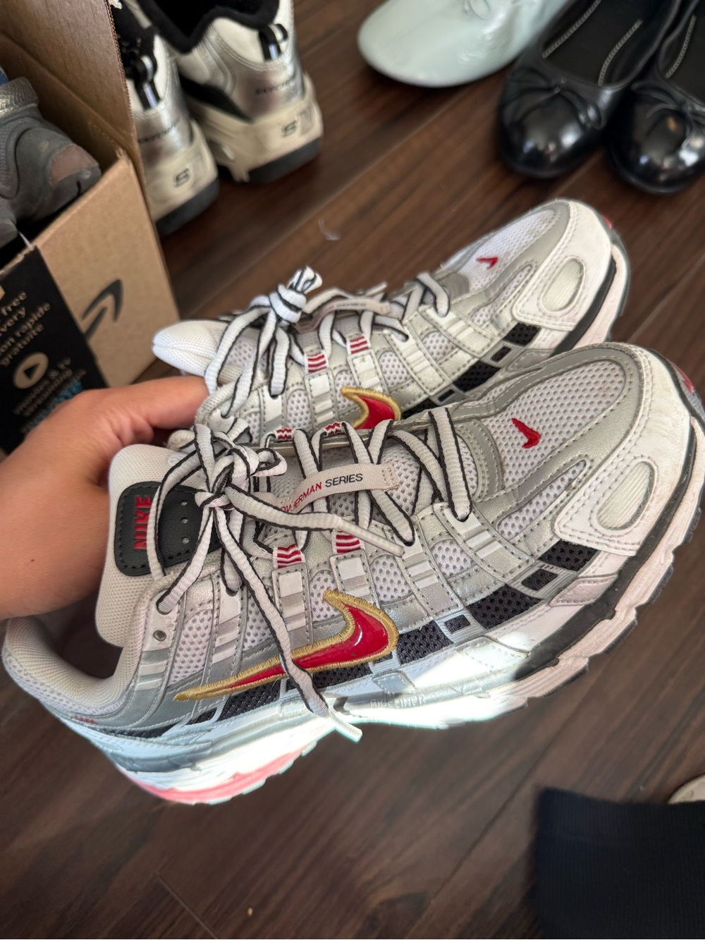 Nike White and Silver Running Sneakers with Red and Gold Swoosh